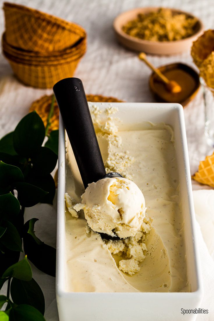 Honey Labneh ice cream in a white rectangular container. In the background waffle boats. Spoonabilities.com