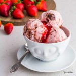 Homemade strawberry ice cream made with a creamy eggless ice cream base, roasted strawberry with honey, white balsamic vinegar & black pepper. Spoonabilities.com