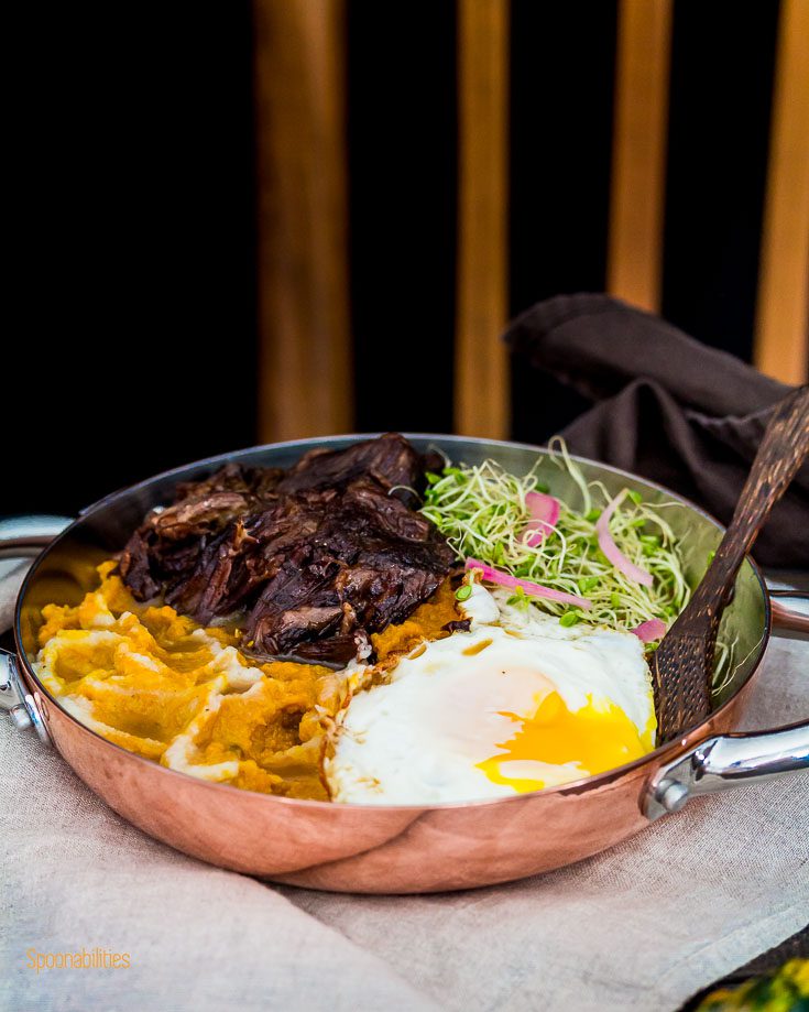 Cooper personal fry pan with Mashed Pumpkin-Cauliflower seasoned with brown butter, crispy fried egg with runny yolk, Alfalfa Sprouts, pickled red onions and braised short ribs with brandy and Middle East spices. spoonabilities.com