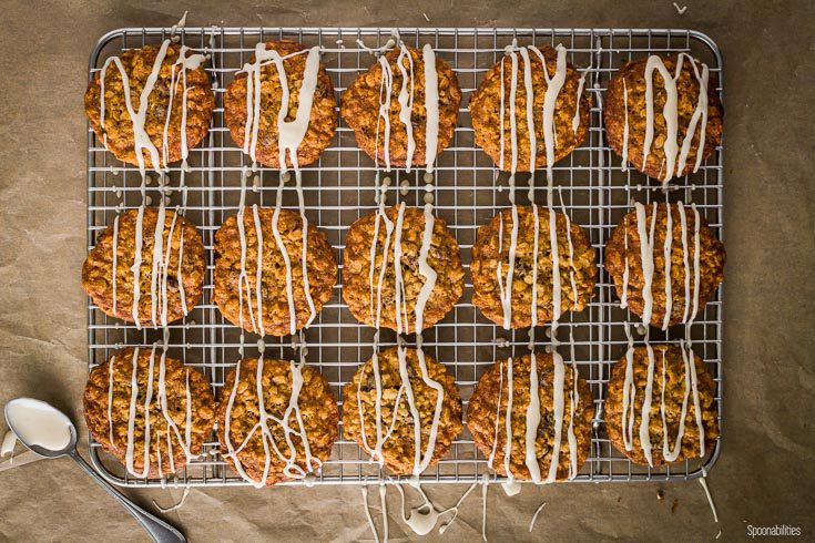 Cookies in a cooling rack with the maple glaze drizzle. Spoonabilities.com