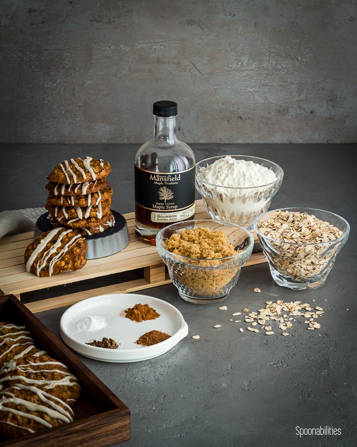 The picture shown the ingredients of the oatmeal cookies for example oatmeal, brown sugar, all purpose flour, spices and Mansfield Maple Syrup Bourbon flavor. Available at spoonabilities.com