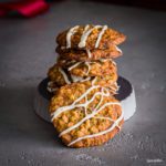 A tower of Oatmeal Raisin Maple Bourbon Cookies with Maple Syrup Glaze. Spoonabilities.com