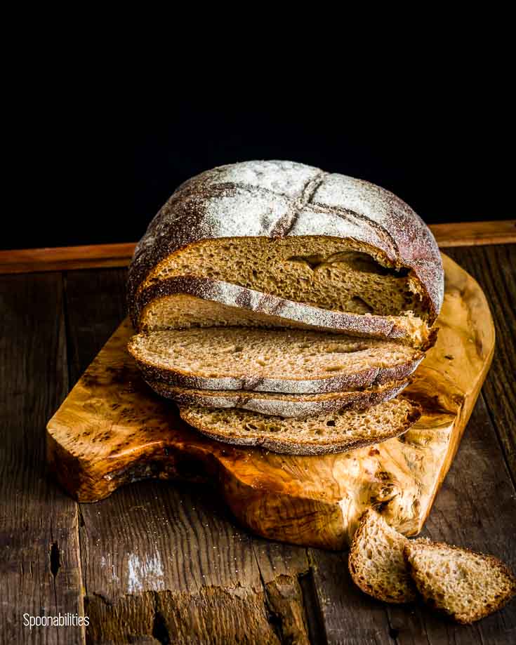 Loaf of crusty bread in a cutting board. Spoonabilities.com