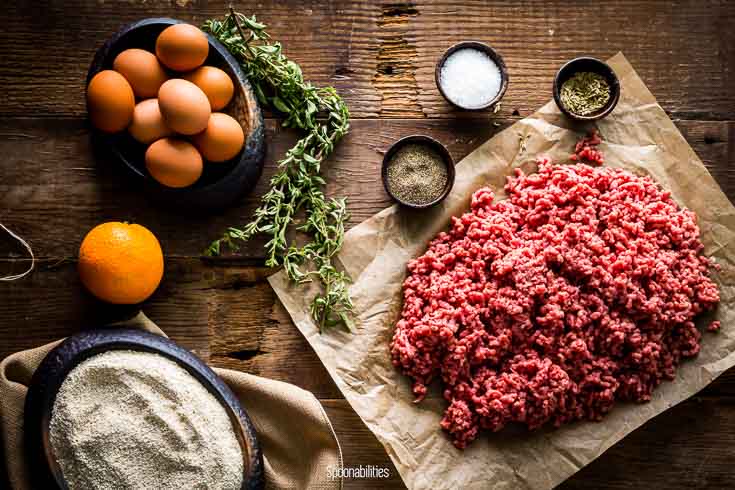 Ingredients for the meatballs: Ground brisket, salt, oregano, marjoram leaves, matzo meal, an orange & eggs. Spoonabilities.com