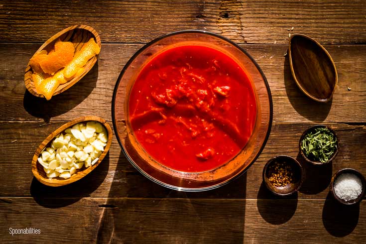 Ingredients for the San Marzano Tomato Sauce: sliced garlic, marjoram, smoked chili flakes, sea salt, San Marzano plum tomatoes, olive oil. Spoonabilities.com