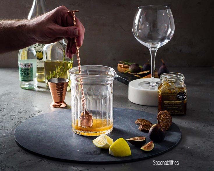 Mixing Fig Marmalade and lemon juice in a glass pitcher
