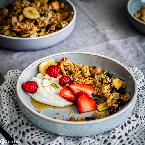 Easy Grain-Free Granola recipe with Nuts, Seeds & Coconut in a cereal bowl. Recipe at Spoonabilities.com