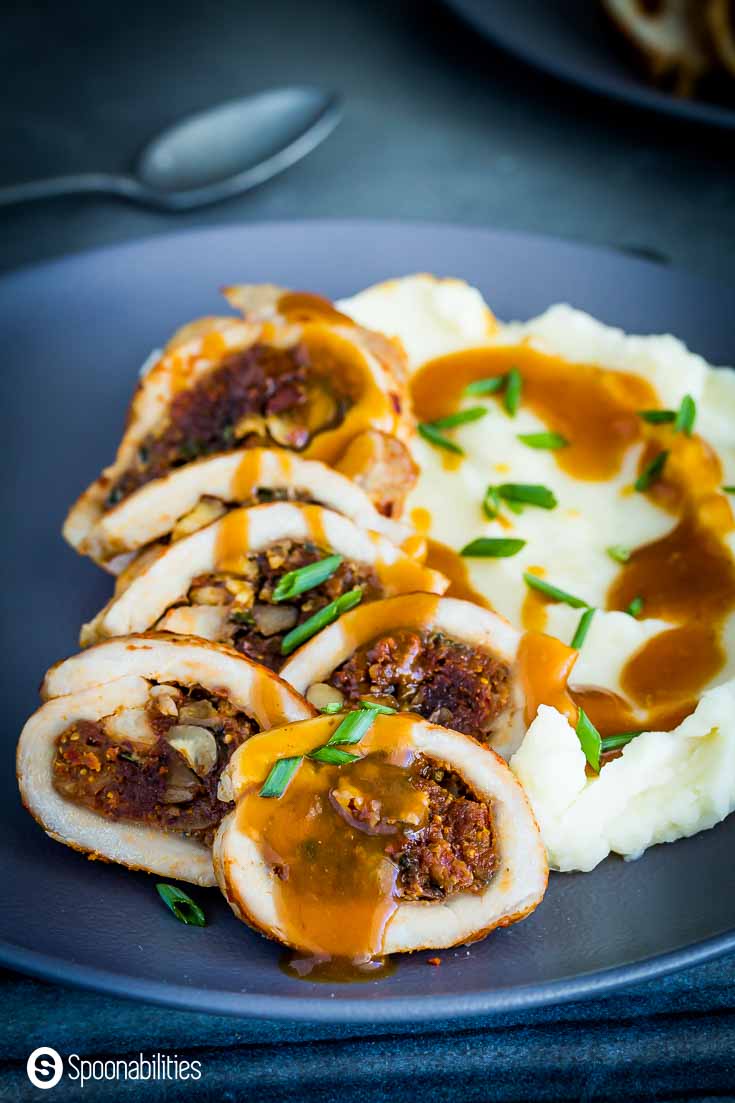 Close up of the pork chops with a sauce dripping from one of the chops. Recipe at Spoonabilities.com