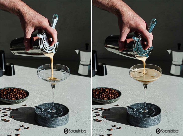 hand pouring shaker glass of espresso cocktail into a martini glass