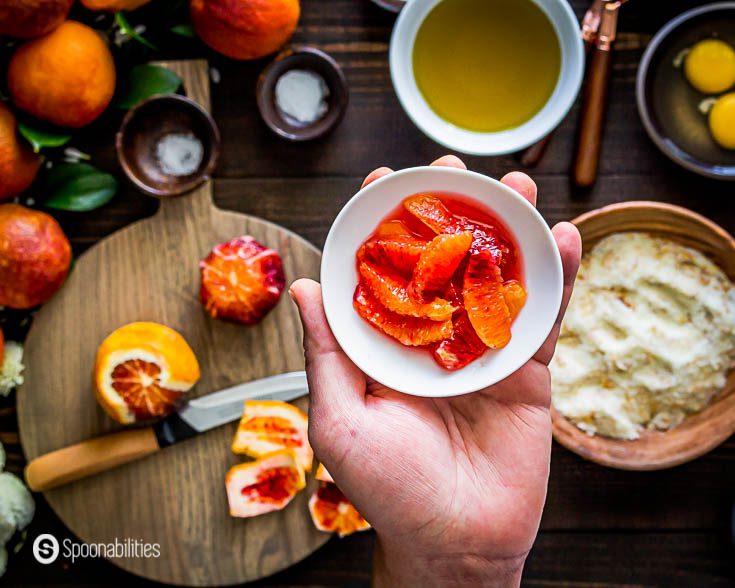 I supreme two of the blood oranges. I'm showing the segments of the blood oranges in a round small bowl. Recipe at Spoonabilities.com