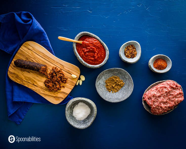 Ingredients for the Easy shakshuka: ground lamb, sea salt, Fig Salami with Aleppo Pepper & Pistachio, Aleppo pepper, oregano, cumin, garlic, and smoked chili flakes . Recipe at Spoonabilities.comRoasted Red Pepper and Tomato Dip