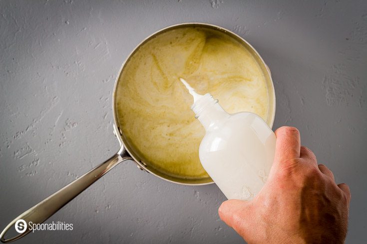 Adding heavy cream and rosewater to the ice cream custard. More details about this recipe at Spoonabilities.com