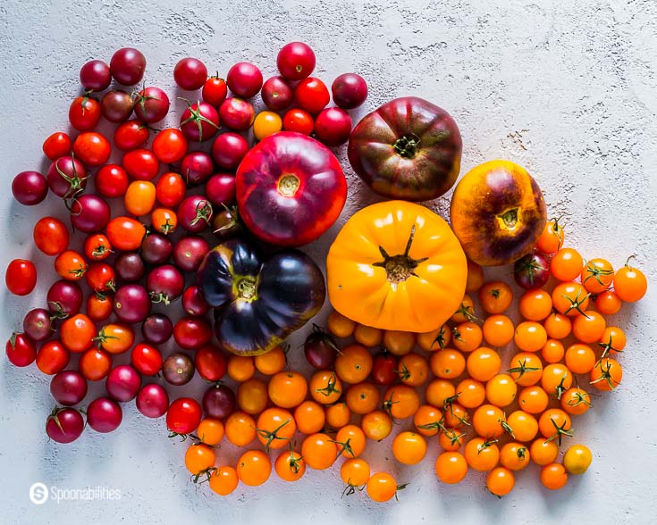 Several varieties of Heirloom tomatoes with cherry tomatoes. More about Heirloom tomatoes at Spoonabilities.com