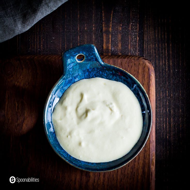 Close up with the Whipped Feta Dip in a small blue dipping bowl. Recipe at Spoonabilities.com