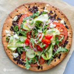 Close up photo for the vegetable pizza recipe. Topped with fresh veggies and cauliflower pizza crust. Recipe at Spoonabilities.com