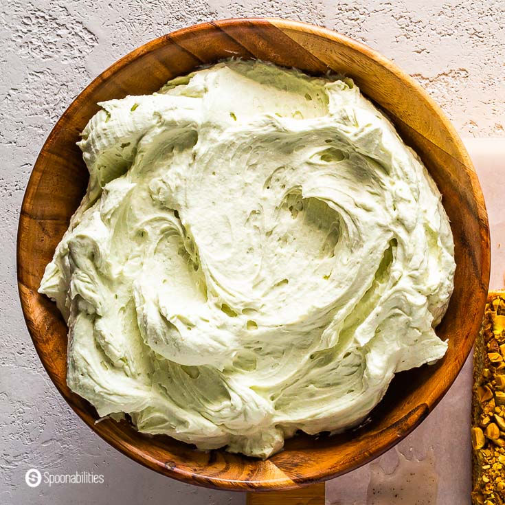 Wooden bowl with Pistachio-Mascarpone Cream. Recipe at Spoonabilities.com