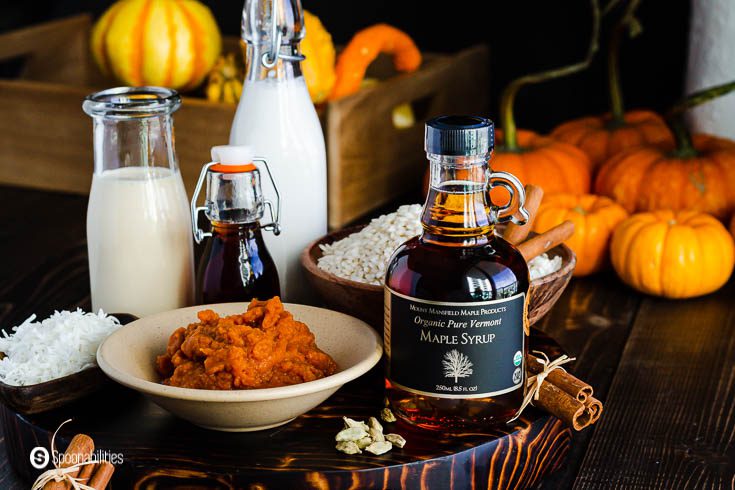 Ingredients for pumpkin rice pudding: Vermont maple syrup, pumpkin puree, cinnamon, cardamom, evaporated milk, Arborio rice, whole milk, and coconut flakes. Recipe at Spoonabilities.com