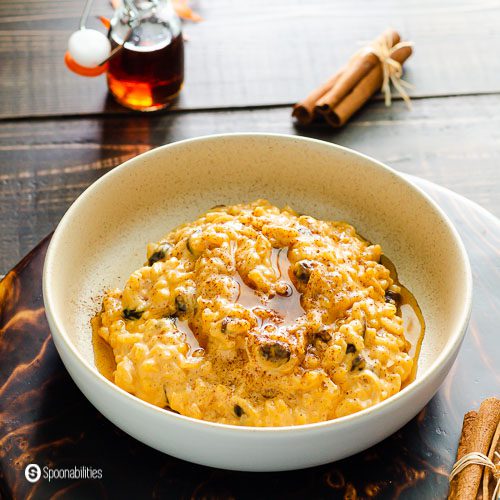 A bowl with rice pudding made with pumpkin puree, coconut cream, Vermont maple syrup, and pumpkin pie spice. Recipe at Spoonabilities.com