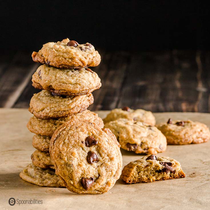 A tower with six of the The Chocolate Chip Cookies and one cookie facing you with three chocolate chips. Recipe at Spoonabilties.com