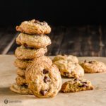 A tower with six of the The best Chocolate Chip Cookies recipe and one cookie facing you with three chocolate chips. Recipe at Spoonabilties.com