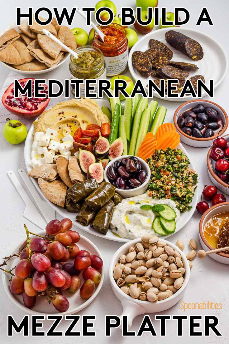 The photo is showing the incredible spread of mezze dishes in a Mediterranean appetizer board. Recipe at Spoonabilities.com