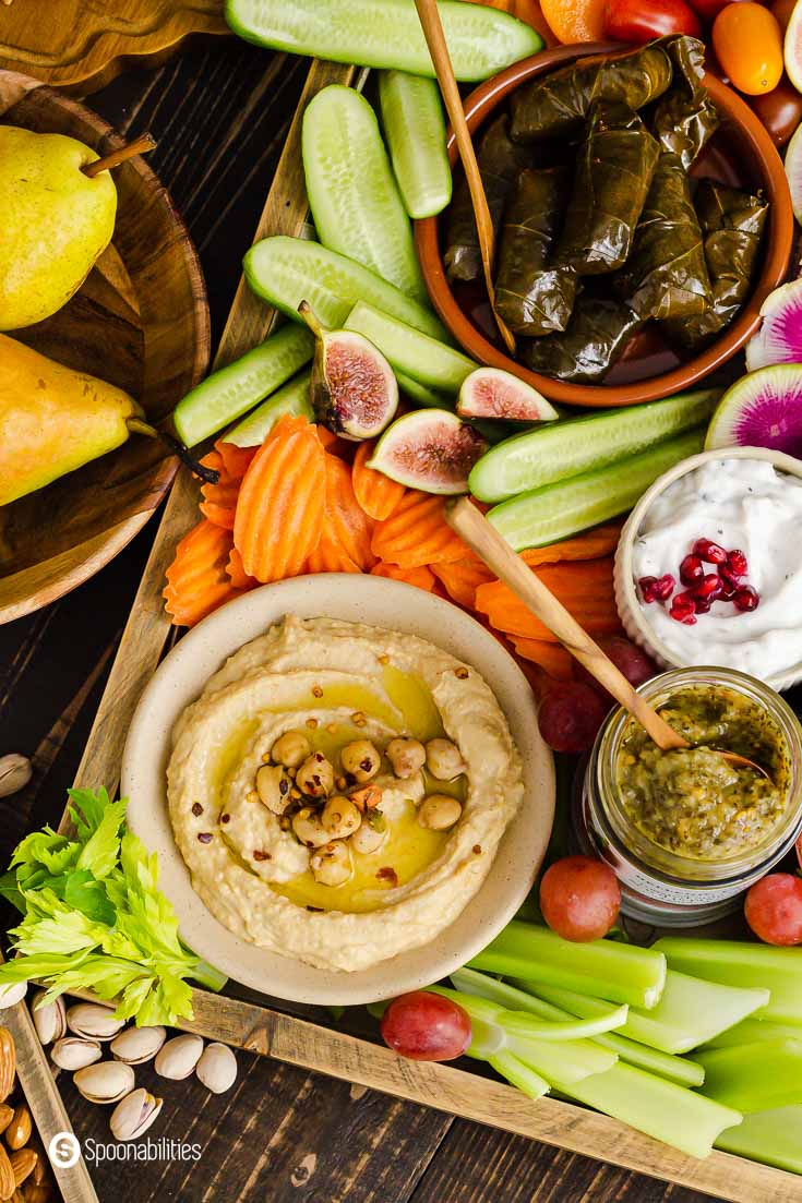 Close up photo of the vegan appetizer platter with hummus, dolma, and vegetables. Recipe at Spoonabilities.com