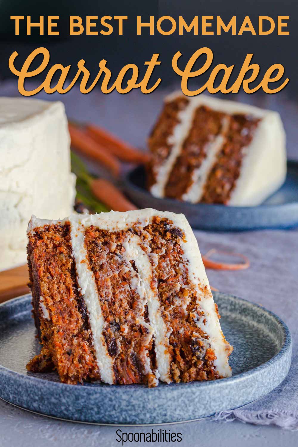 A slice of the BEST carrot cake on a blue round plate. in the background, the cake in the stand, and another serving. Recipe at Spoonabilities.com