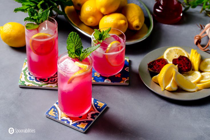 Three glasses with prickly pear agua fresca.