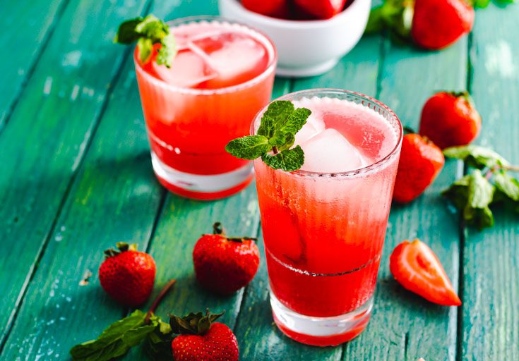 two glasses filled with strawberry mint tea