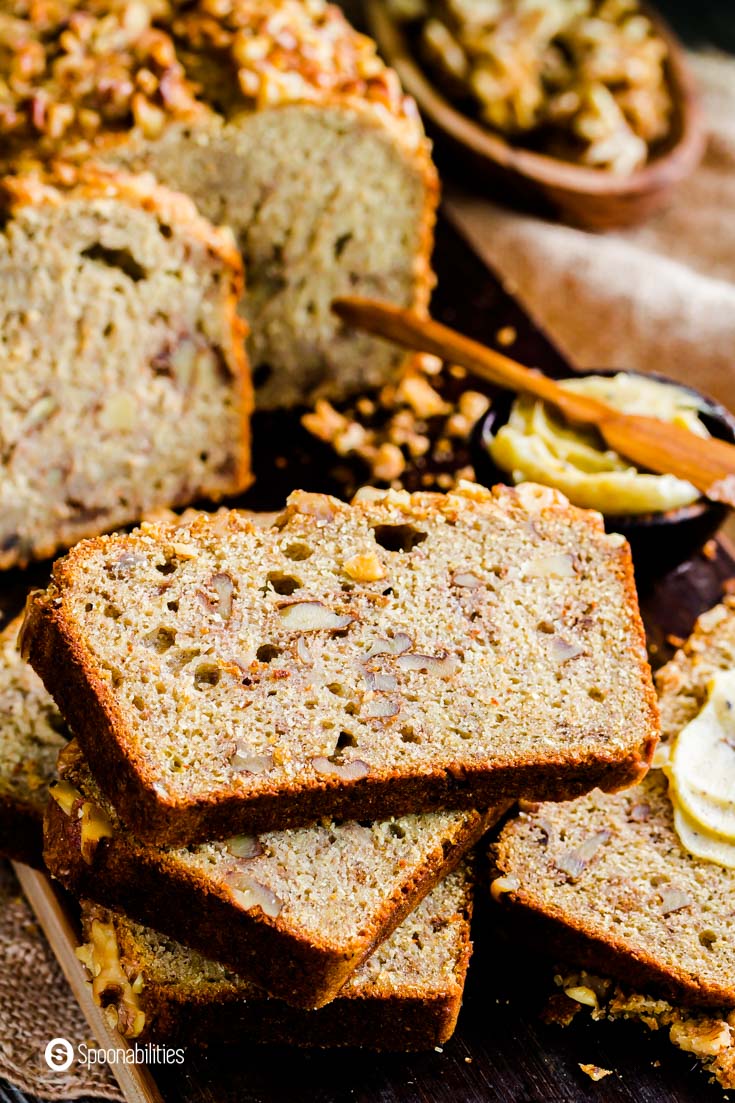 Slices of banana bread made of sourdough discard, nuts, honey, and Greek olive oil. Recipe at Spoonabilities.com