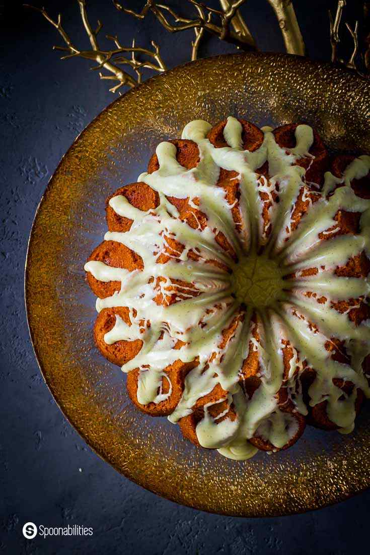 Close up and overhead photo showing the top crown of the dramatic Eggnog Bundt Cake with the glaze. Recipe at Spoonabilities.com