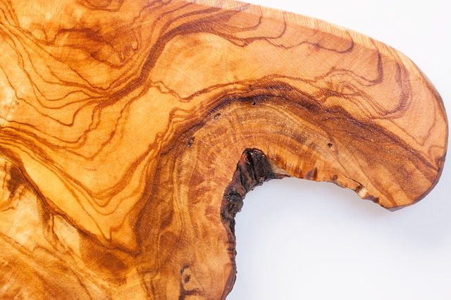 Olive wood used in boards for charcuterie, showcasing a beautiful grain pattern