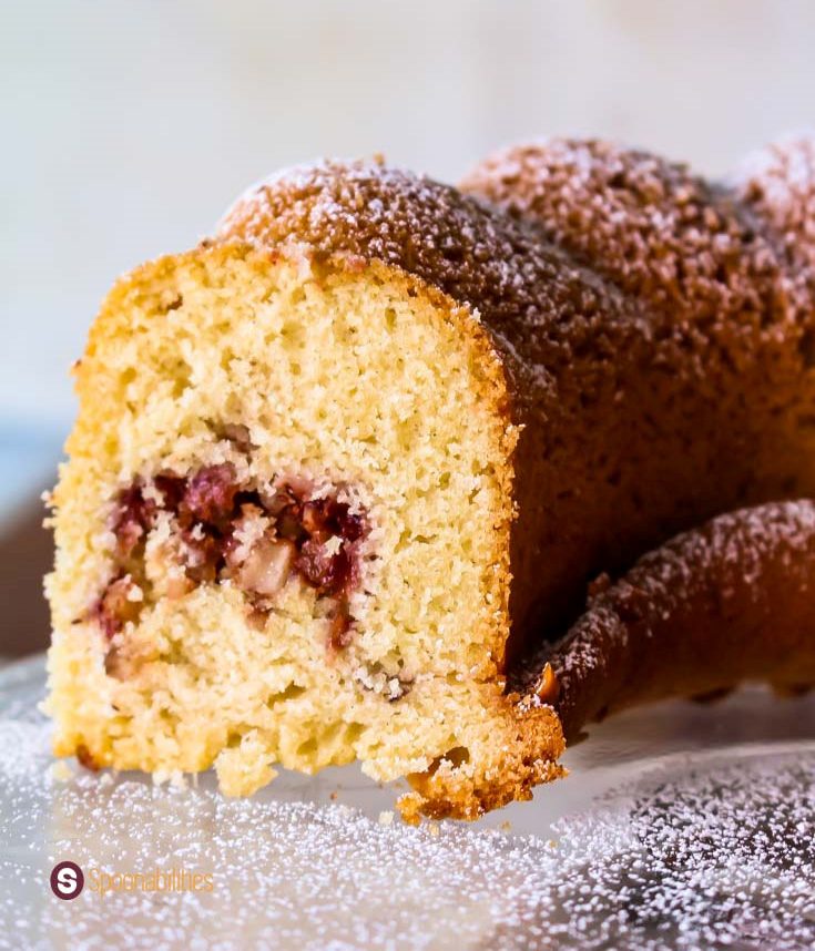 open section of lingonberry cake so you can see the hazelnut and lingonberry filling