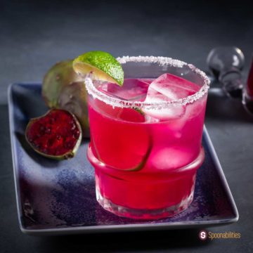 Salt-rimmed rock glass with prickly pear margarita. Recipe at Spoonabilities.com