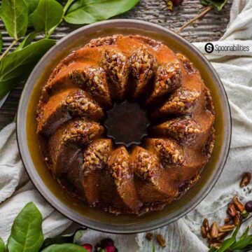 a photo of full Pecan Pie Bundt Cake with brown sugar syrup made in the shape of the Kugelhopf Bundt pan