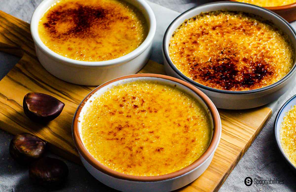 Three Chestnut Crème Brûlées and roasted chestnuts at the side