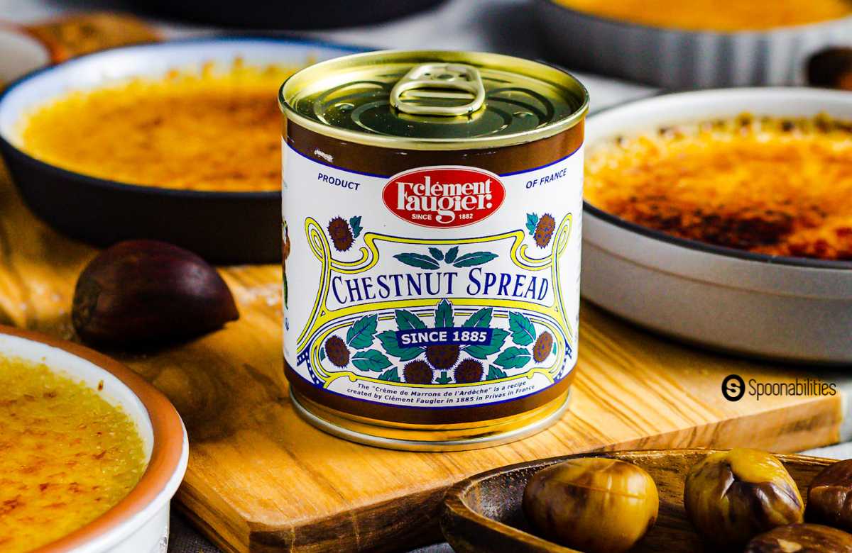 A can of chestnut spread among creme brulees and chestnuts