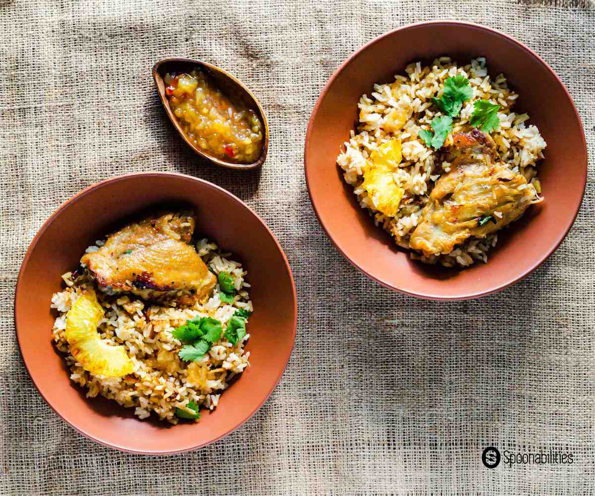 A couple of servings of Arroz con Pollo with Roasted Pineapple Habanero Sauce