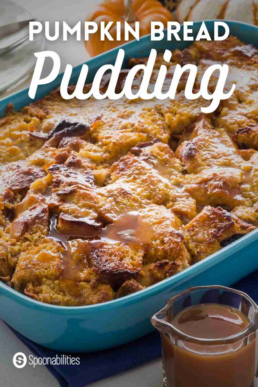 Pumpkin Bread pudding in a blue baking pan drizzled with salted butter caramel