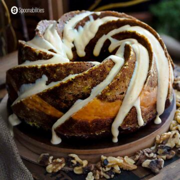 Close up Shot of Pumpkin Carrot Bundt Cake with generous cream cheese drizzle