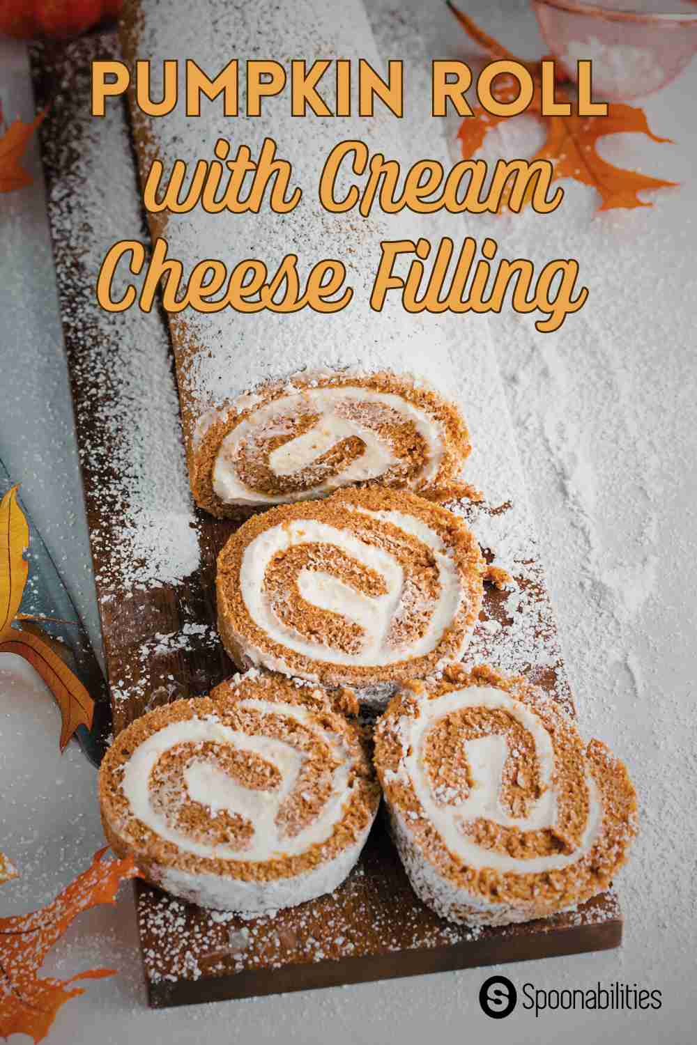 Three slices of cake from a Pumpkin Roll with cream cheese filling on a wooden chopping board