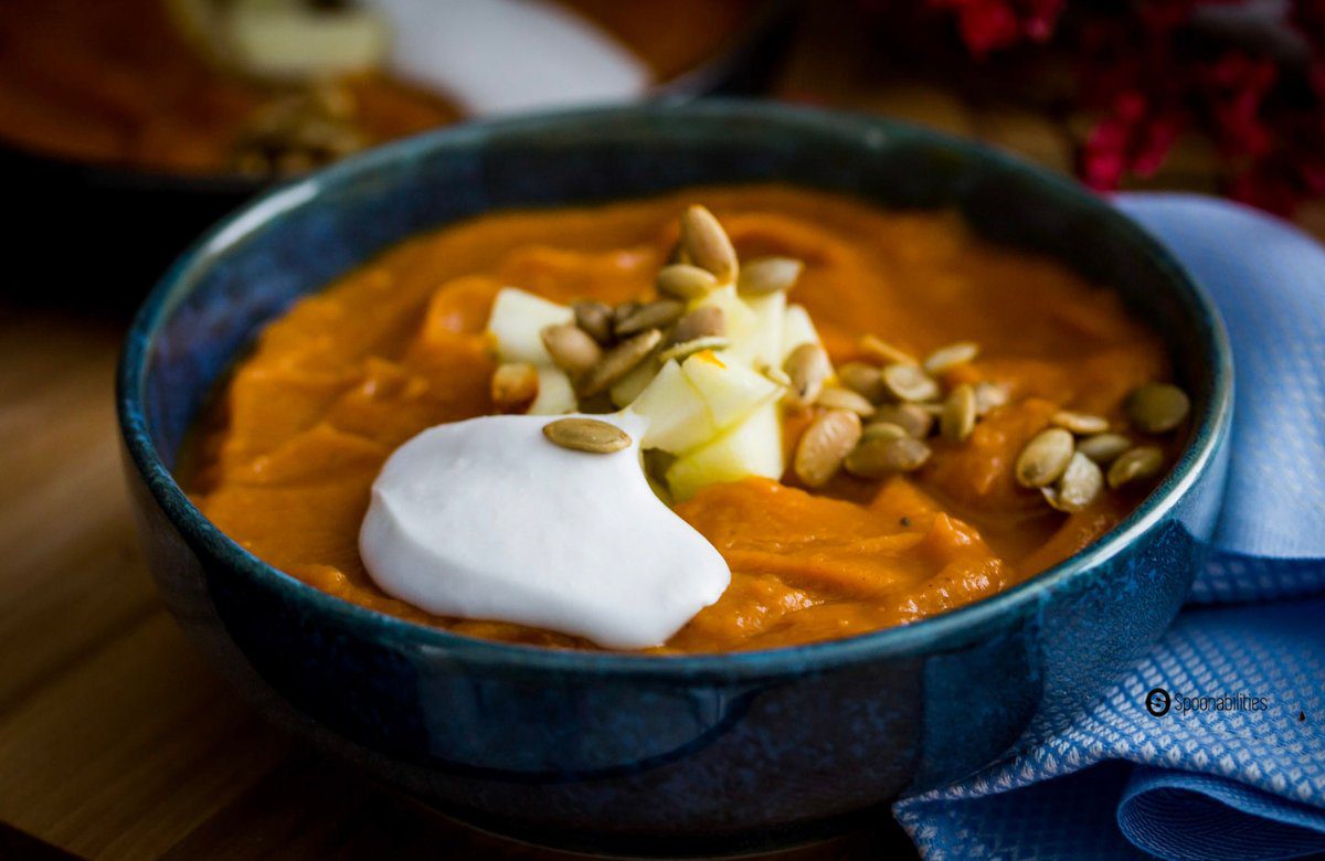 Close up shot of a bowl of pumpkin bisque