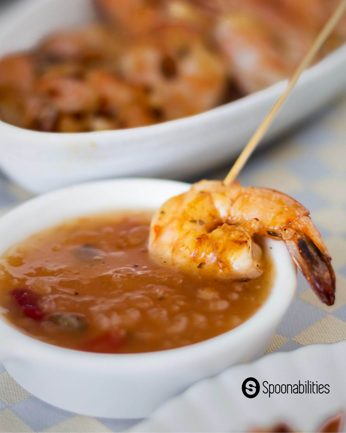 Pan Grilled Shrimp in Roasted Pineapple Habanero Sauce on a tiny saucer