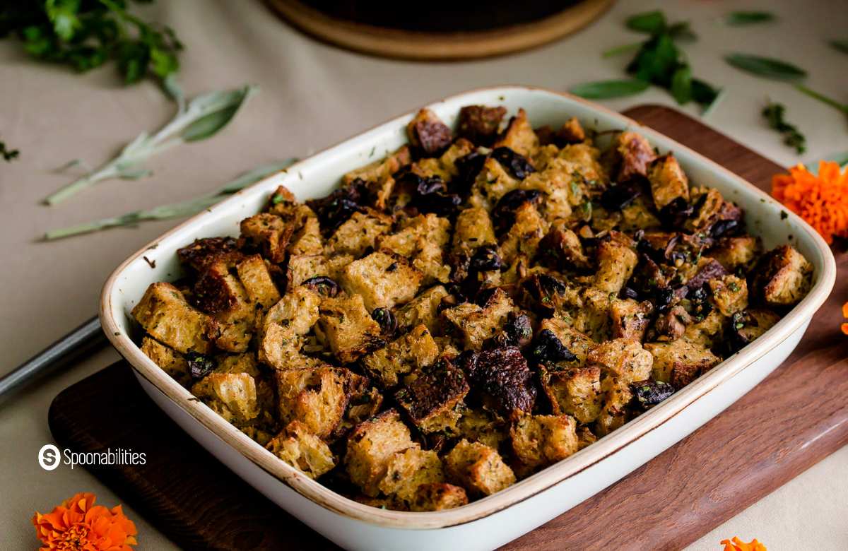 Three mushroom stuffing in a white baking dish