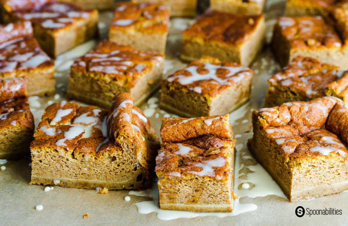 Pumpkin Magic Cake cut into squares and drizzled with syrup