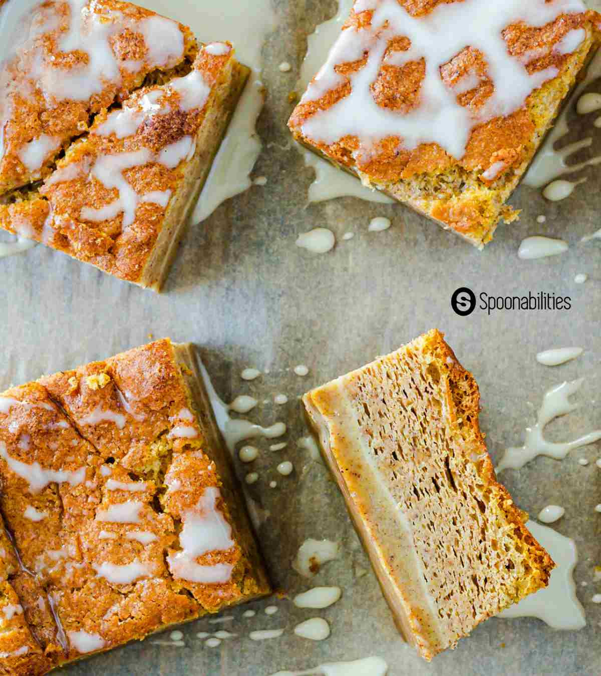 Four Magic Pumpkin Cake squares with drizzle