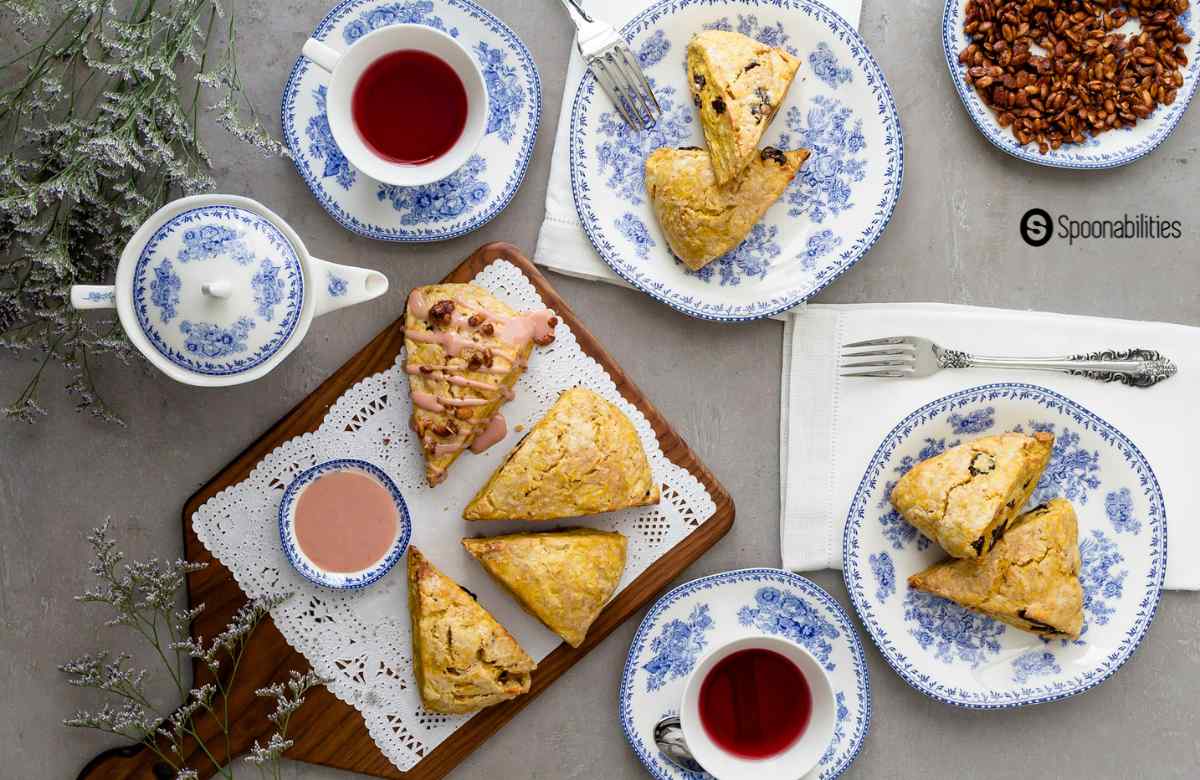 Pumpkin scones served in a white and blue plates and tea set