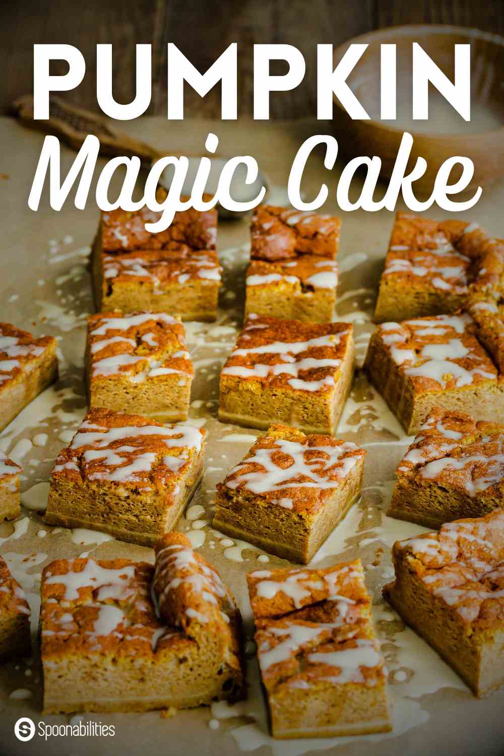 Pumpkin Magic Cake squares drizzled with maple syrup