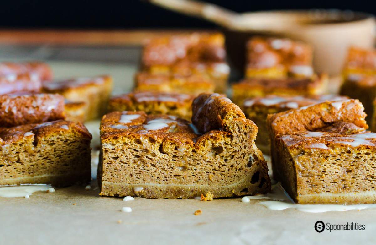 Close up of three pumpkin magic cake squares