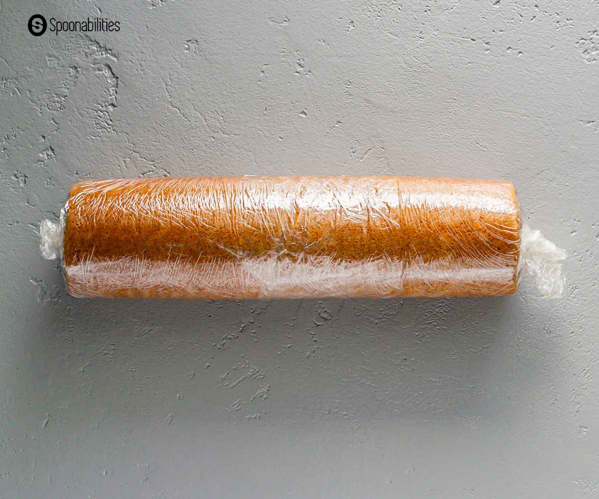 Pumpkin cake rolled inside a plastic cling wrap